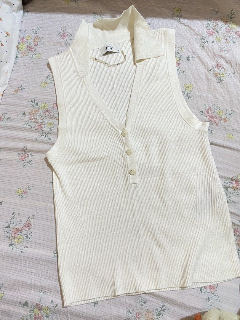 (JDY) White Ribbed Collared Sleeveless Knit Top Size S (Category: Sleeveless) located in Imus. Submitted by softclosetph (Listing ID 1470488516, Image 2). Description: - Brand: JDY - Color: White - Size: S (fits true to size) - Material: Lightweight, stretchy ribbed knit - Details: Collared V-neckline with 3 front buttons - Condition: Brand new with tag attached - Style: Casual basic top, perfect for warm weather.