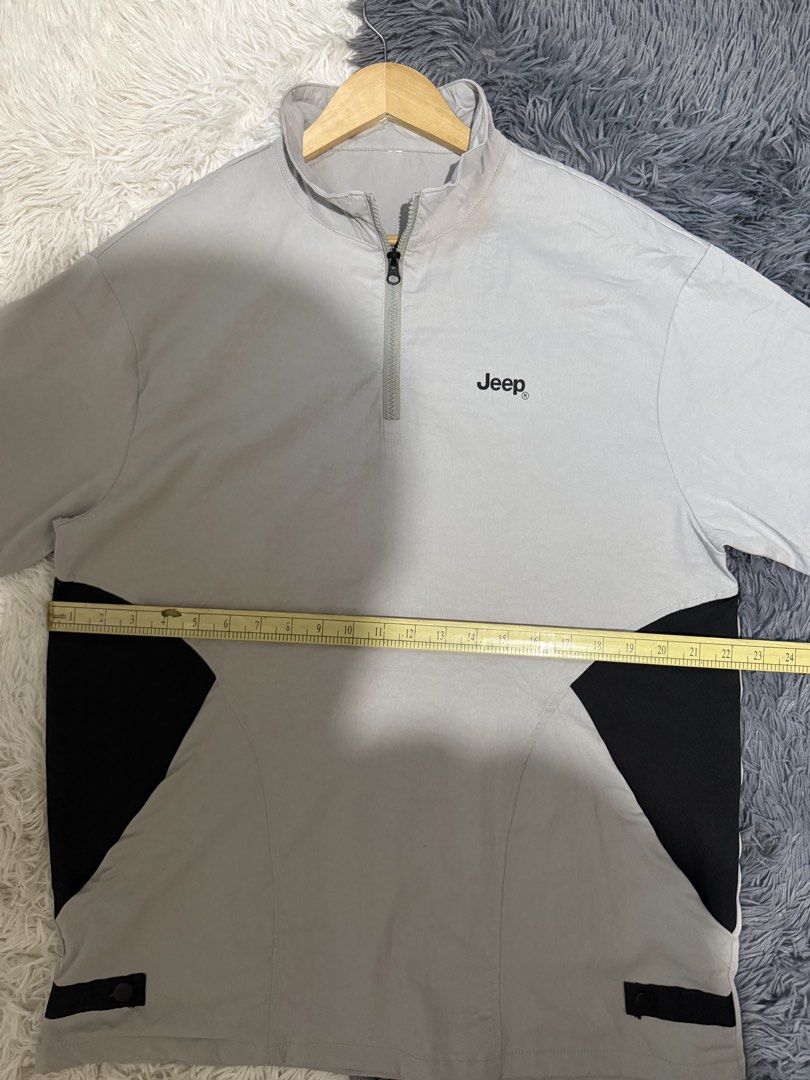 Jeep Grey Half-Zip Short Sleeve Shirt (Category: Tshirts & Polo Shirts ) located in Manila. Submitted by keepercollection (Listing ID 1470380406, Image 2). Description: - Brand: Jeep - Color: Grey with black contrast side panels - Design: Short sleeves, quarter-zip collar with black zipper pull, and embroidered chest logo - Fabric: Lightweight and stretchy for ultimate comfort - Condition: Clean and well-maintained.