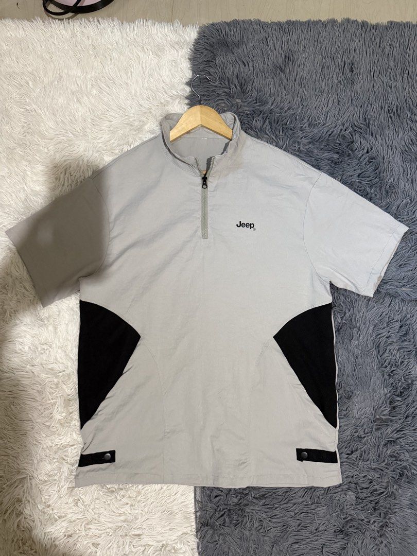 Jeep Grey Half-Zip Short Sleeve Shirt (Category: Tshirts & Polo Shirts ) located in Manila. Submitted by keepercollection (Listing ID 1470380406, Image 1). Description: - Brand: Jeep - Color: Grey with black contrast side panels - Design: Short sleeves, quarter-zip collar with black zipper pull, and embroidered chest logo - Fabric: Lightweight and stretchy for ultimate comfort - Condition: Clean and well-maintained.