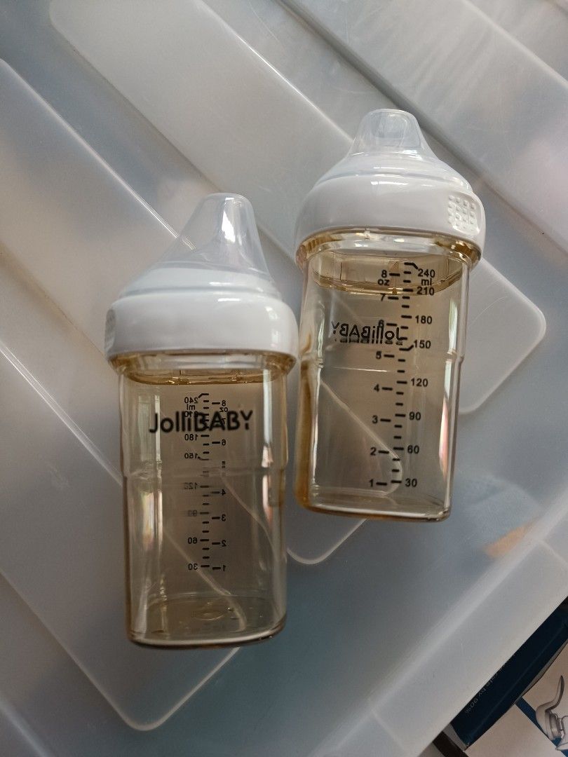 JOLLIBABY Feeding Bottles 240ml 8oz Pair (Category: Breastfeeding & Bottle Feeding) located in Orani. Submitted by mbfb_btn (Listing ID 1470436928, Image 1). Description: - Brand: Jollibaby - Quantity: Set of 2 baby bottles - Capacity: 240ml / 8oz each - Features clear ml and oz measurement markings - Includes white screw caps and protective covers - Anti-roll square shape design that is easy for little hands to hold - Brand new and ready to use.