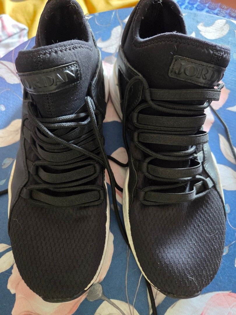 Jordan Men's Shoes (Category: Sneakers) located in Pasig City. Submitted by tatashki (Listing ID 1470389728, Image 2). Description: - Brand/Model: Black Jordan sneakers - Size: US 8 / EUR 41 - Design: Unique lacing system, white soles, and heel pull tabs - Condition: Worn condition with signs of wear on midsoles and interiors - Style: Great everyday sporty kicks Sold as is , please check all the photos .