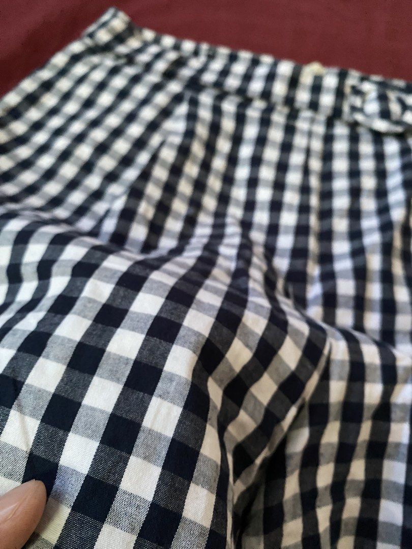 Juslin Black and White Gingham Shorts Size L (Category: Shorts) located in Manila. Submitted by love_mami (Listing ID 1470439587, Image 3). Description: - Size: Fits 27 - Brand: Juslin - Conditions: excellent 9-10 - Size: Large (tag attached) - Pattern: dark blur gingham - Waist: High-waisted with back zipper closure - Extra: Includes matching fabric belt with round buckle - Design: Pleated front, lightweight fabric ideal for warm weather.