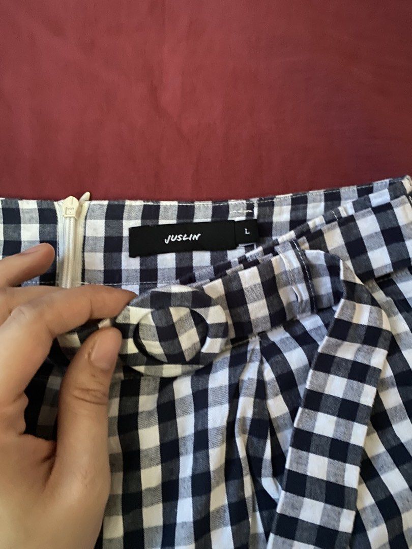 Juslin Black and White Gingham Shorts Size L (Category: Shorts) located in Manila. Submitted by love_mami (Listing ID 1470439587, Image 2). Description: - Size: Fits 27 - Brand: Juslin - Conditions: excellent 9-10 - Size: Large (tag attached) - Pattern: dark blur gingham - Waist: High-waisted with back zipper closure - Extra: Includes matching fabric belt with round buckle - Design: Pleated front, lightweight fabric ideal for warm weather.