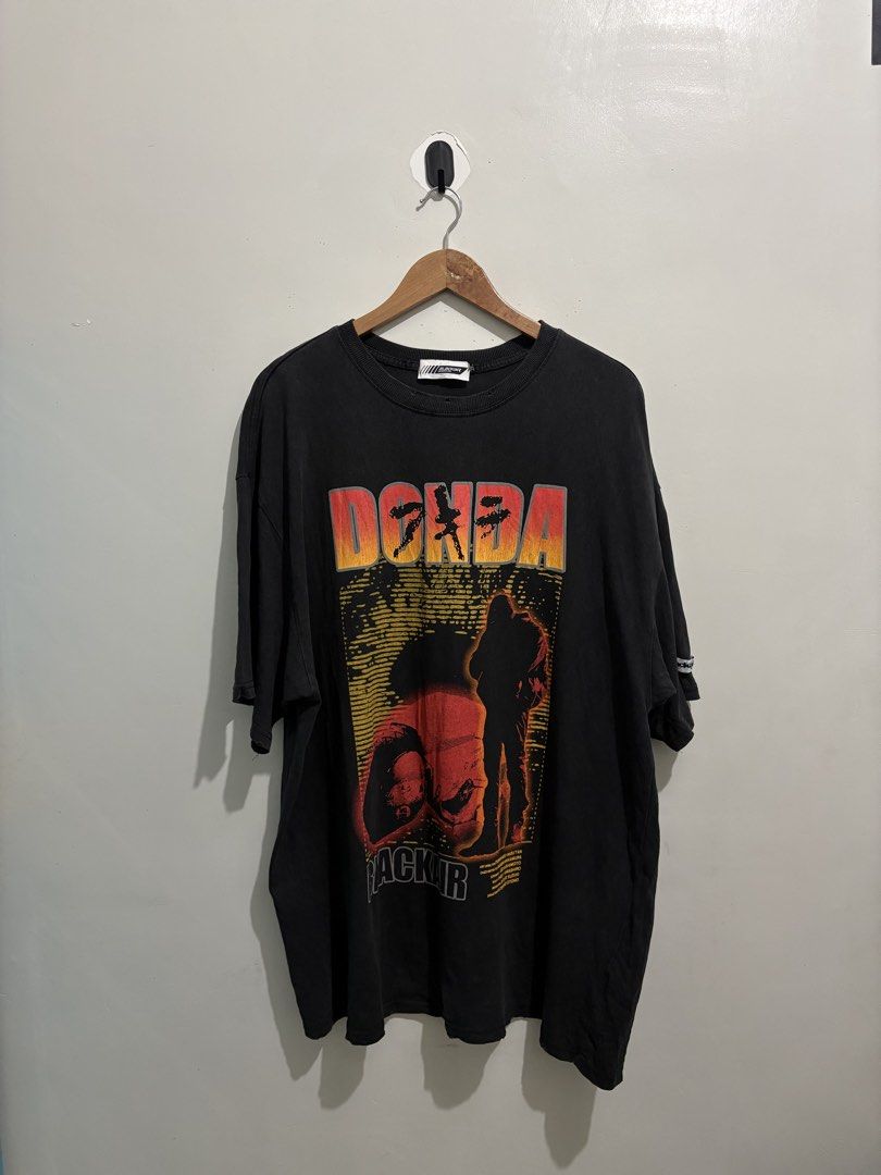 Kanye West x Black Air Donda Tee (Category: Tshirts & Polo Shirts ) located in Cabiao. Submitted by thelifeofgelo (Listing ID 1470459544, Image 1). Description: Kanye West x Black Air Donda Tee Distressed style Size: XXL Width: 25 Length: 32 Good as new Price: 1000 + sf .