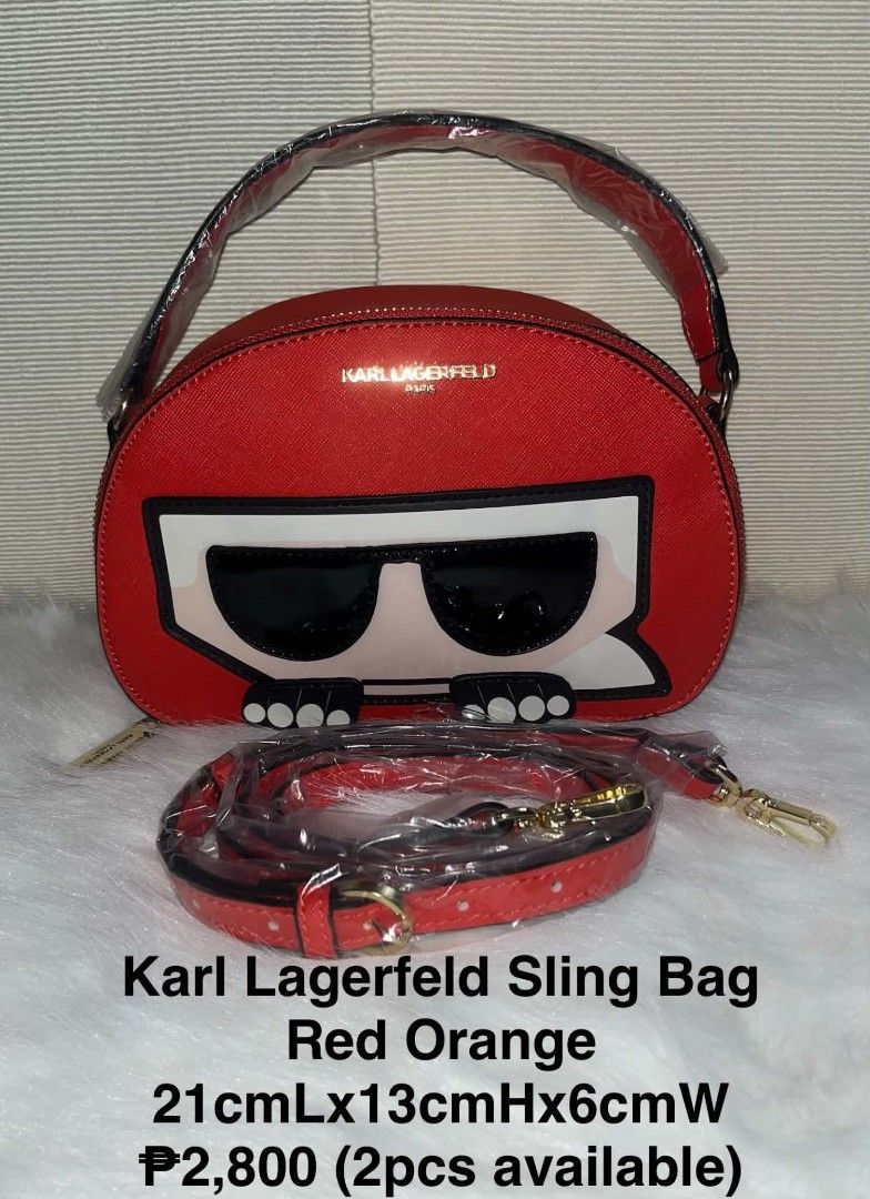 Karl Lagerfeld Red Orange Sling Bag (Category: Cross-body Bags) located in Imus. Submitted by maria_pilayo (Listing ID 1470437198, Image 1). Description: - Brand: Karl Lagerfeld - 💯 % Authentic - Color: Vibrant Red Orange - Design: Compact structured sling bag with iconic Karl graphic on the front - Hardware & Accents: Premium gold-tone hardware with attached top handle - Dimensions: 21cm (L) x 13cm (H) x 6cm (W) - Strap: Matching adjustable str