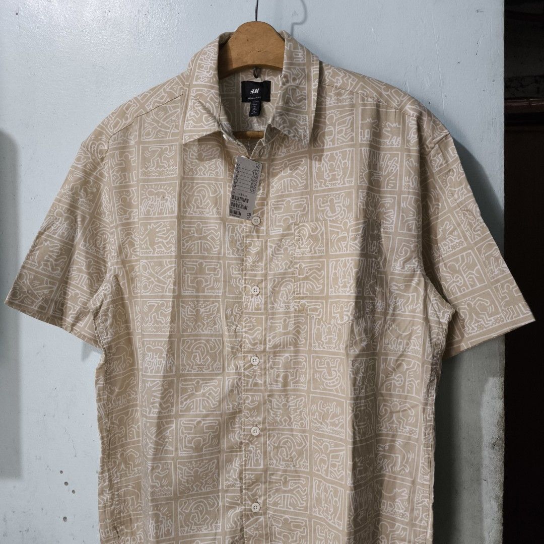 Keith Haring x H&M Short Sleeve Button Down (Category: Tshirts & Polo Shirts ) located in Quezon City. Submitted by jedclo (Listing ID 1470483053, Image 1). Description: Size S Width: 22 Length: 28 In pristine condition Color due lightning MOP: GCASH, DM to purchase Disclaimer: "All brand names, logos, and images are registered trademarks of their respective owners. No affiliation or copyright infringement intended.
