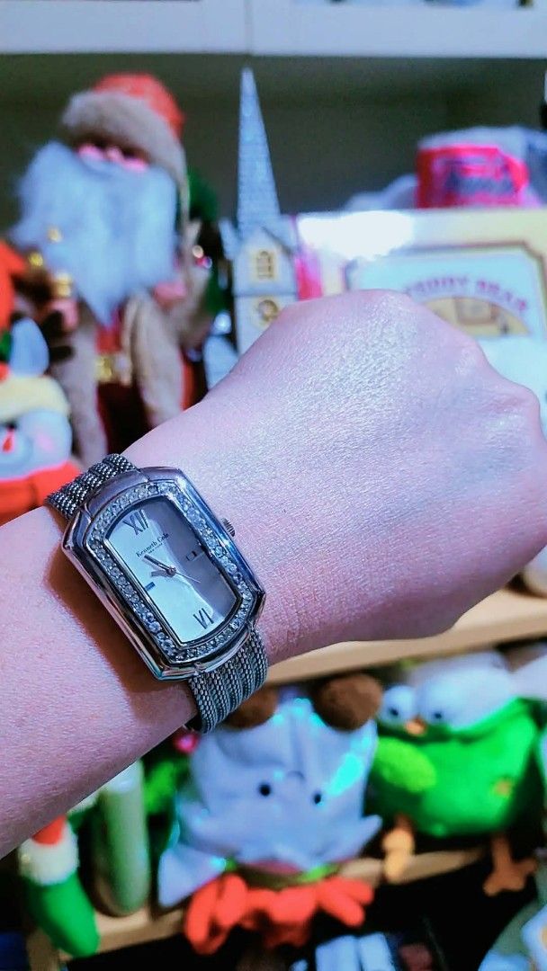 Kenneth Cole New York Crystal Rectangle Wristwatch Silver Mesh Strap (Category: Women's Watches) located in Baliuag. Submitted by marieannfernando23 (Listing ID 1470368402, Image 3). Description: - Brand: Kenneth Cole - Style: Silver-tone rectangular face watch with minimalist dial - Accents: Sparkling crystals on the bezel, Roman numerals at 12 and 6 o'clock - Strap: Unique woven mesh metal bracelet - Movement: Reliable quartz movement - Versati