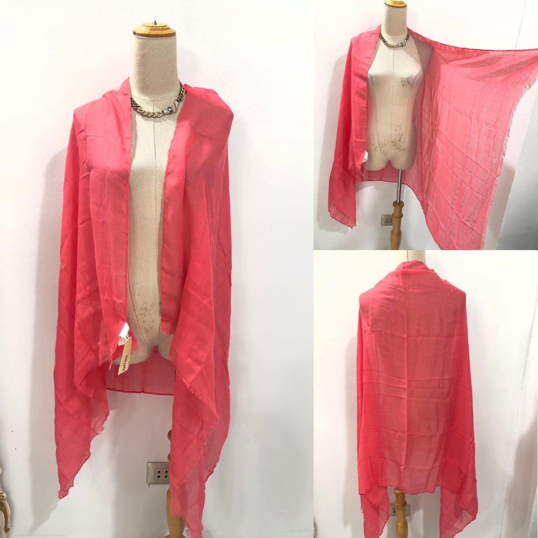 KENZO Pink Scarf with Original Packaging (Category: Scarves) located in Bacolod City. Submitted by bhabissagal-05763 (Listing ID 1470404250, Image 1). Description: - Brand: Kenzo - Color: Bright pink - Condition: Brand new with original tags in branded drawstring pouch - Material: Lightweight and drapes nicely over shoulders - Design: Rectangular shape with stylish fringed edges - Styling: Adds a vibrant pop of color to any outfit.