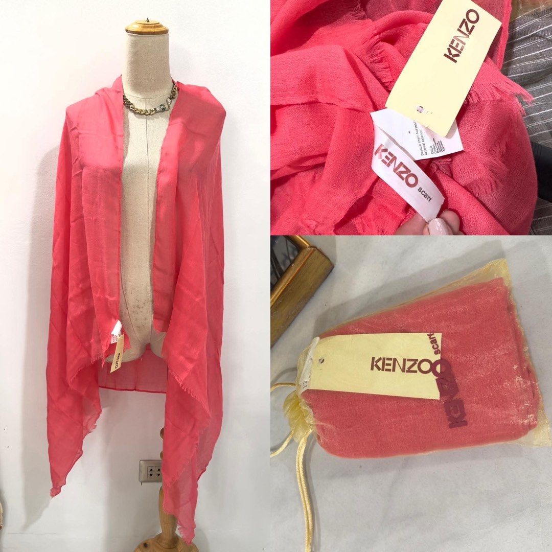 KENZO Pink Scarf with Original Packaging (Category: Scarves) located in Bacolod City. Submitted by bhabissagal-05763 (Listing ID 1470404250, Image 2). Description: - Brand: Kenzo - Color: Bright pink - Condition: Brand new with original tags in branded drawstring pouch - Material: Lightweight and drapes nicely over shoulders - Design: Rectangular shape with stylish fringed edges - Styling: Adds a vibrant pop of color to any outfit.