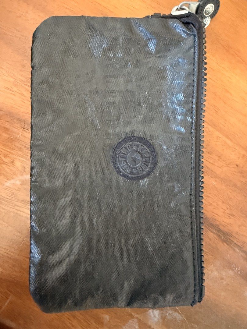 Kipling Piano Piano Keys Multi-Compartment Pouch Creativity Large (Category: Purses & Pouches) located in Quezon City. Submitted by clemg6 (Listing ID 1470421028, Image 1). Description: - Authentic Kipling piano keyboard print pouch - Sturdy zipper closure with embossed circular logo pull - Multiple inner zippered compartments for cards, coins, and small essentials - Dark textured finish on the back side - Versatile size, perfect for daily use or
