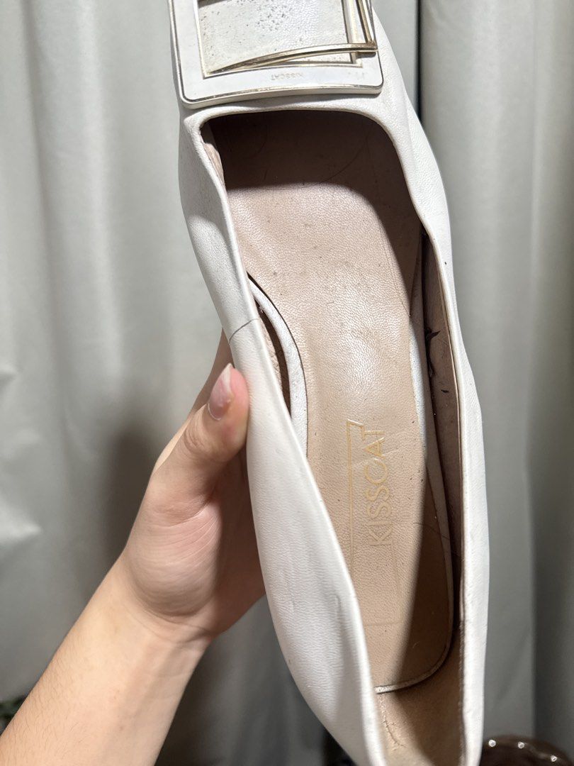 Kisscat White Kitten Heels Size 36 (Category: Heels) located in Abucay. Submitted by fastlion.584bdf (Listing ID 1470532847, Image 3). Description: - Brand: Kisscat - Color: White - Style: Kitten heels with a statement square buckle - Size: 36 / 230 - Material: Sheepskin upper, pigskin lining - Condition: Worn a few times; minor scuffs on soles and light creasing on leather upper - Original retail tag still attached (1199 RMB) - Perfect and versa