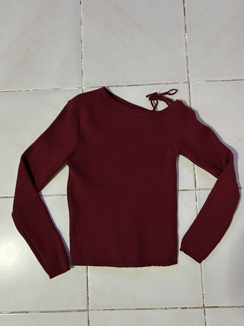 Knitted Maroon Asymmetrical Top (Category: Longsleeves) located in Manila. Submitted by viyyu (Listing ID 1470415449, Image 1). Description: •shoulder cutout with self-tie string detail on one shoulder •Slim fit with round neckline •Stretchy ribbed knit with good stretch •thick fabric.