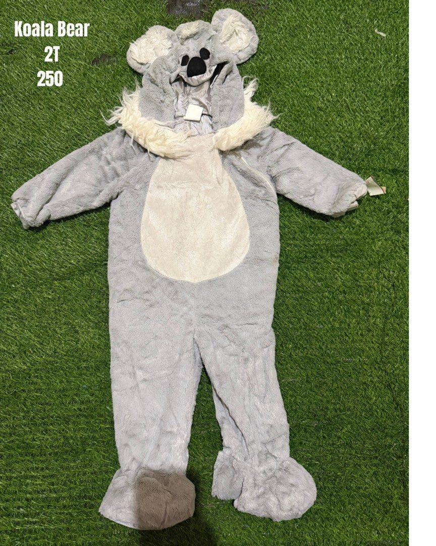 Koala Bear Costume Size 2T (Category: Babies & Kids Fashion) located in San Fernando. Submitted by InvisibleMe (Listing ID 1470452854, Image 1). Description: - Size: Toddler 2T - Design: Grey koala with attached hood, fuzzy ears, black nose details, and white chest patch - Comfort: Super soft, cozy plush material with integrated feet covers - Versatility: Great for Halloween, costume parties, and dress-up play - Condition: Brand new and ready to 