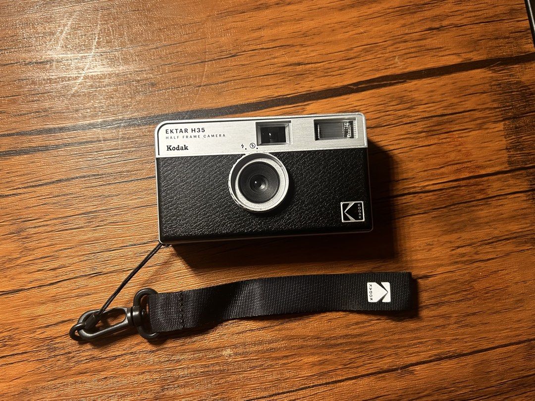 Kodak Ektar H35 Half Frame Camera (Category: Cameras) located in Makati City. Submitted by nzel.0 (Listing ID 1470489737, Image 1). Description: FOR SALE 📸 - Model: Kodak Ektar H35 Half Frame Film Camera - Color: Silver and Black - Format: Uses standard 35mm film (gives double the shots per roll!) - Features: Focus-free lens, built-in flash, and lightweight plastic body - Inclusion: Original branded wrist strap, and the Camera itself (No origina