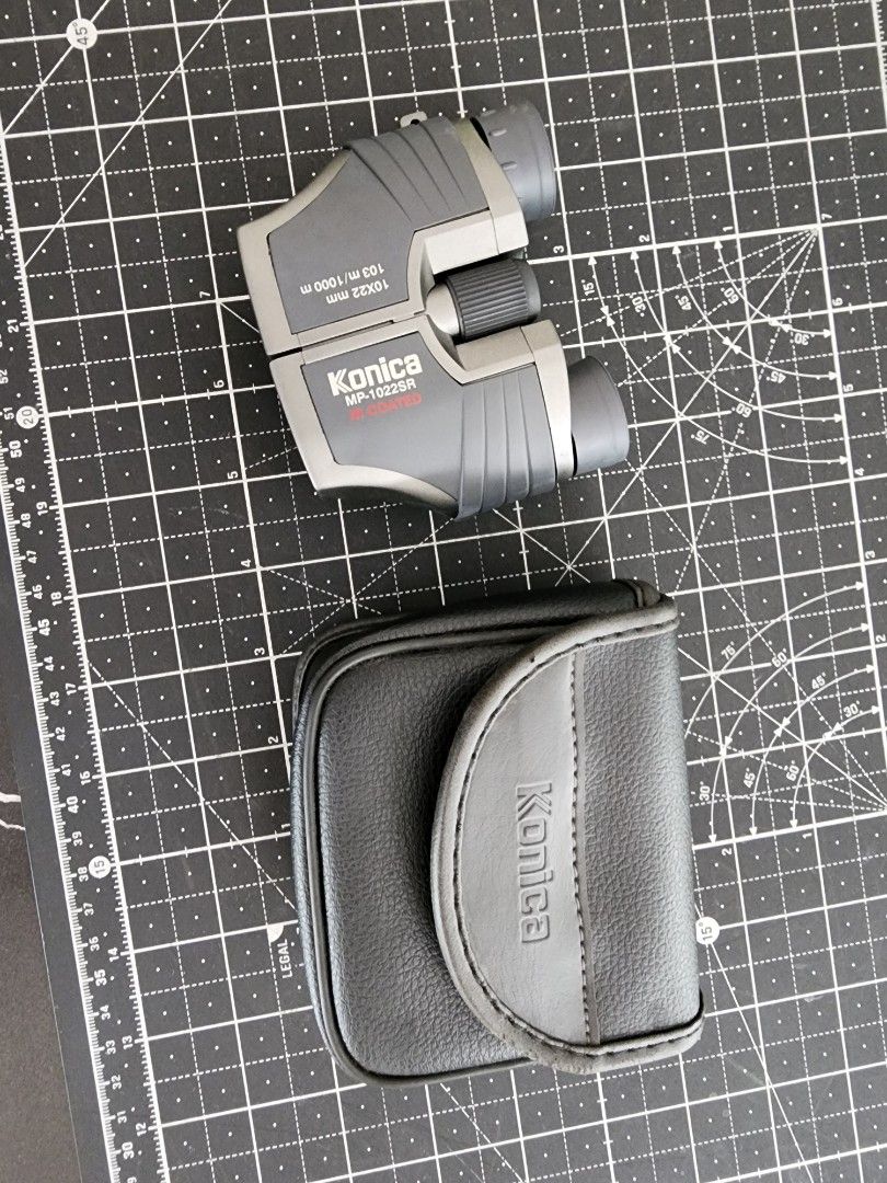 Konica MP-1022SR 10x22mm IR Coated Binoculars with Case (Category: Hiking & Camping) located in Quezon City. Submitted by kristeenl556 (Listing ID 1470401287, Image 1). Description: - Model: Konica MP-1022SR compact binoculars - Power: 10x magnification with 22mm objective lens - Optics: IR coated for clear and crisp viewing - Design: Stylish gray and silver body with smooth central focusing and adjustable eyepieces - Ideal For: Concerts, travel,