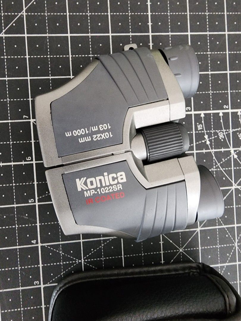 Konica MP-1022SR 10x22mm IR Coated Binoculars with Case (Category: Hiking & Camping) located in Quezon City. Submitted by kristeenl556 (Listing ID 1470401287, Image 2). Description: - Model: Konica MP-1022SR compact binoculars - Power: 10x magnification with 22mm objective lens - Optics: IR coated for clear and crisp viewing - Design: Stylish gray and silver body with smooth central focusing and adjustable eyepieces - Ideal For: Concerts, travel,