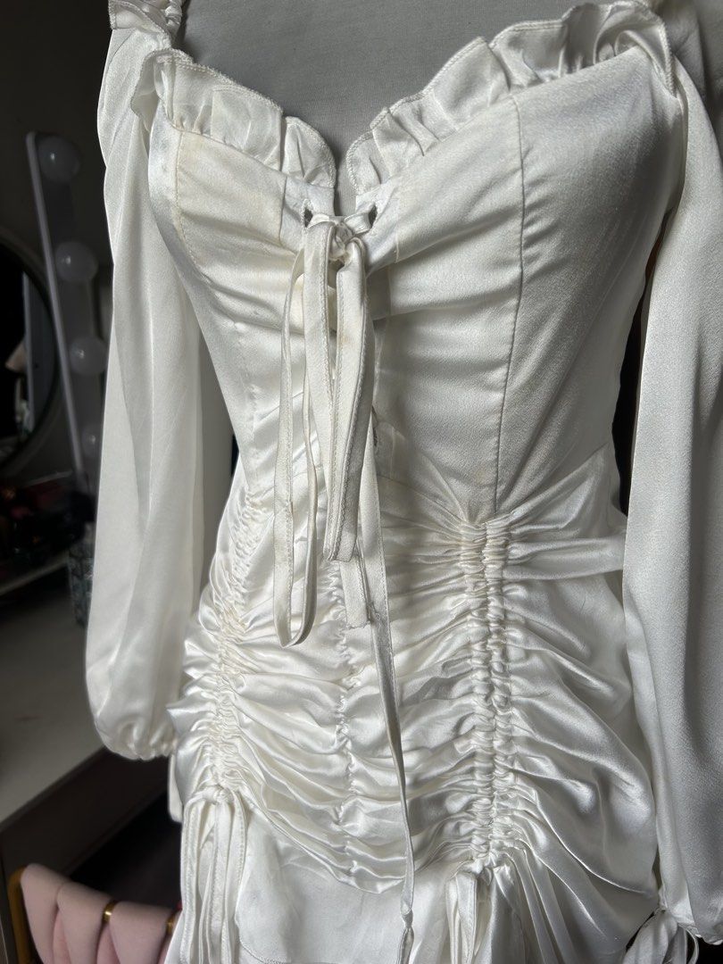 Korean white ruched dress (Category: Dresses) located in Cainta. Submitted by ziellune (Listing ID 1470385134, Image 3). Description: Medium Unused Can be worn as Halloween costume Has a minimal stain due to storaging Not noticable except sa natural sunlight Zipper at the back Inner lining & zipper at the back.
