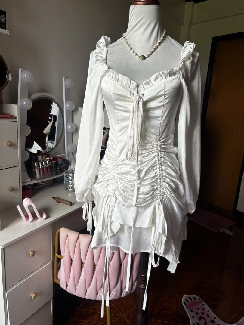 Korean white ruched dress (Category: Dresses) located in Cainta. Submitted by ziellune (Listing ID 1470385134, Image 1). Description: Medium Unused Can be worn as Halloween costume Has a minimal stain due to storaging Not noticable except sa natural sunlight Zipper at the back Inner lining & zipper at the back.