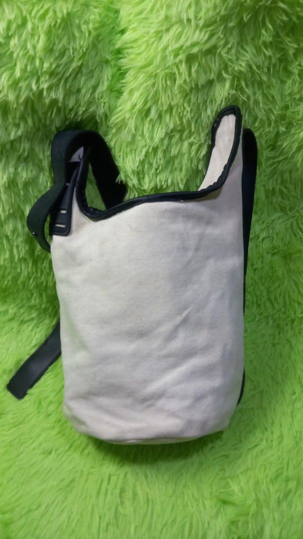 Korean-style Geometric Pattern Shoulder Bag (Category: Shoulder Bags) located in Manila. Submitted by twinklelyn03 (Listing ID 1470408798, Image 3). Description: - Trendy monochrome canvas shoulder bag with an abstract sketch graphic print - Durable black leather-look straps and trim - Spacious bucket shape ideal for everyday casual use - Secure magnetic snap closure with a zippered main compartment - Includes an inner zip pocket with patterned l