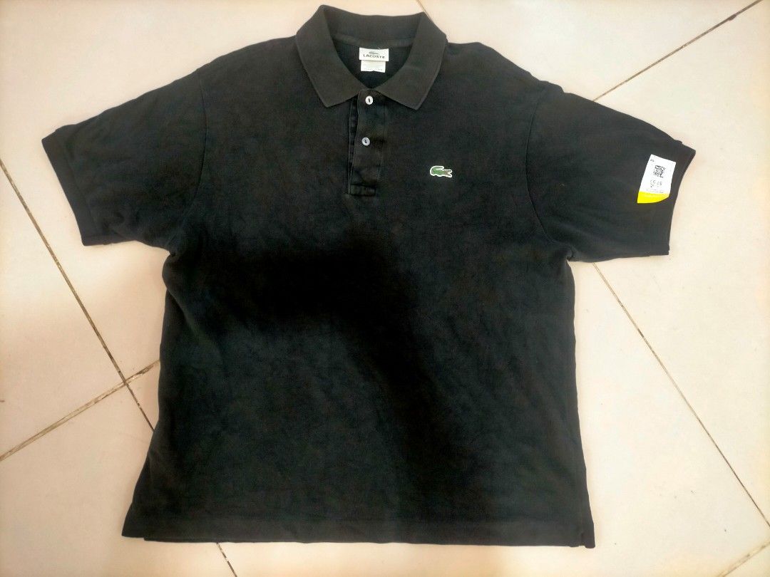 Lacoste Black Polo Shirt Size 6 (Category: Tshirts & Polo Shirts ) located in Manila. Submitted by zenphoenix_b0c89e (Listing ID 1470443482, Image 1). Description: - Brand: Lacoste - Color: Black - Size: 6 (Standard fit) - Material: 100% Cotton (Style: 5191L, Made in Peru) - Design: Short sleeves, button placket - Branding: Iconic green embroidered crocodile logo on the chest - Condition: Breathable and comfortable fabric.