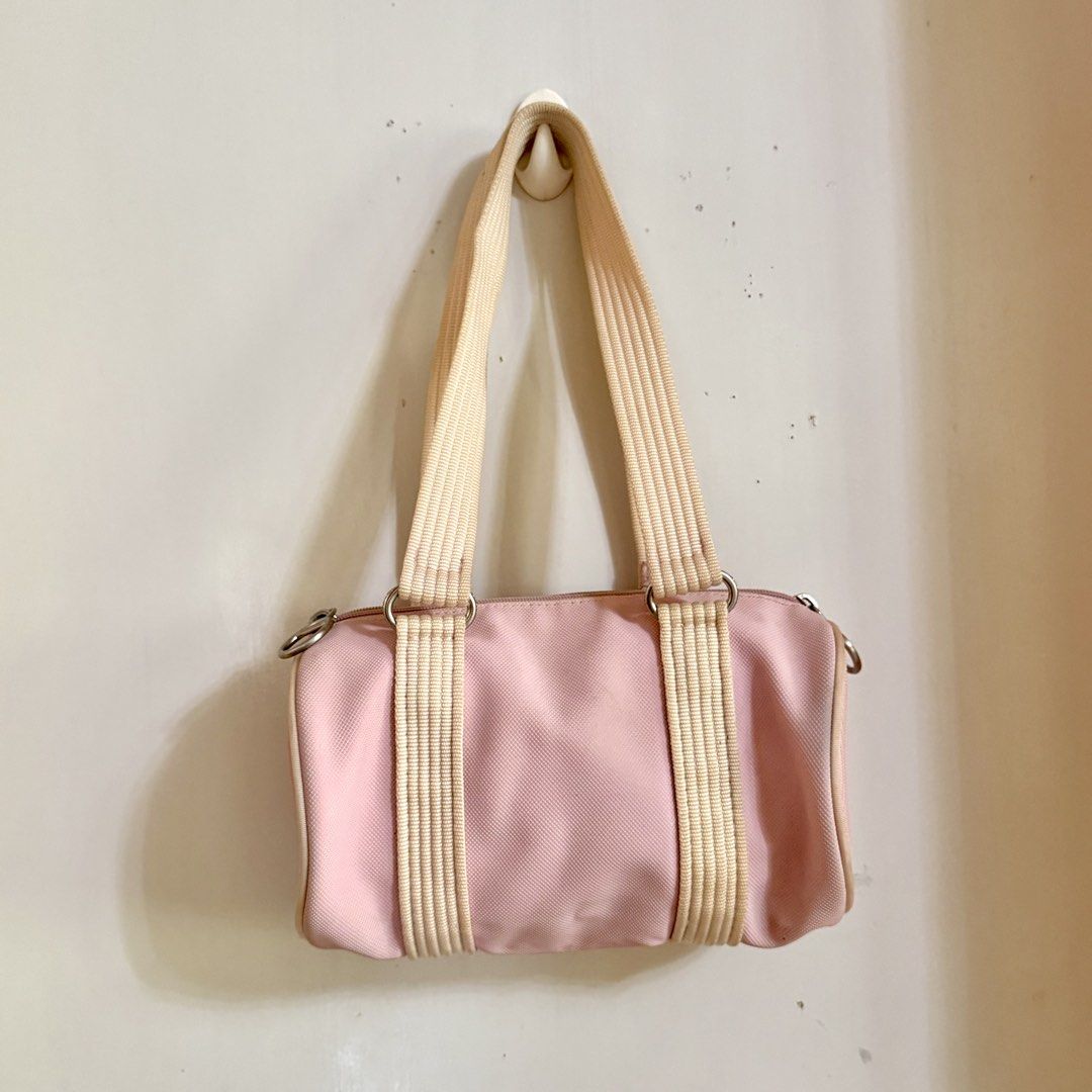 Lacoste Mini Barrel Bag (Category: Luxury Bags & Wallets) located in Cavite. Submitted by vintage.bratz (Listing ID 1470394169, Image 3). Description: • Pink • Well taken care of (lady owned) • No rubs on canvas • Needs a little cleaning.