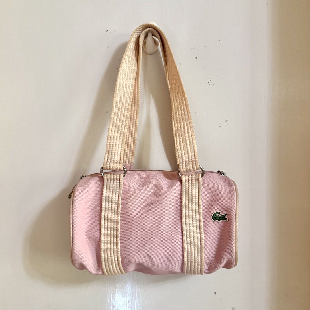 Lacoste Mini Barrel Bag (Category: Luxury Bags & Wallets) located in Cavite. Submitted by vintage.bratz (Listing ID 1470394169, Image 1). Description: • Pink • Well taken care of (lady owned) • No rubs on canvas • Needs a little cleaning.