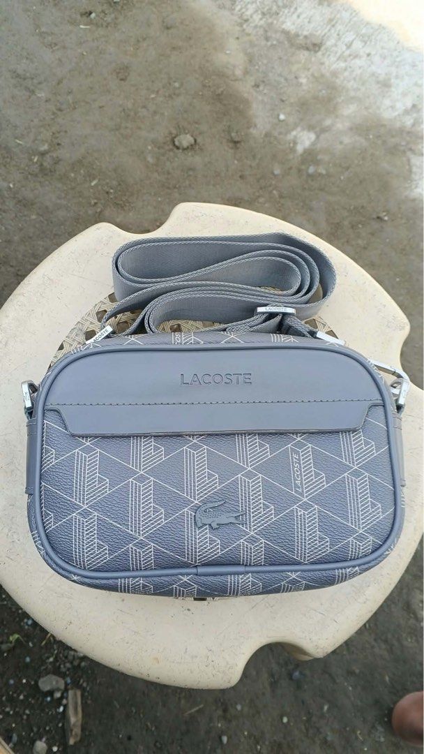 Lacoste mono gram sling bag (Category: Luxury Bags & Wallets) located in Bayambang. Submitted by frugal_vouge (Listing ID 1470366137, Image 1). Description: Issue see pic minimal only not visible when worn.