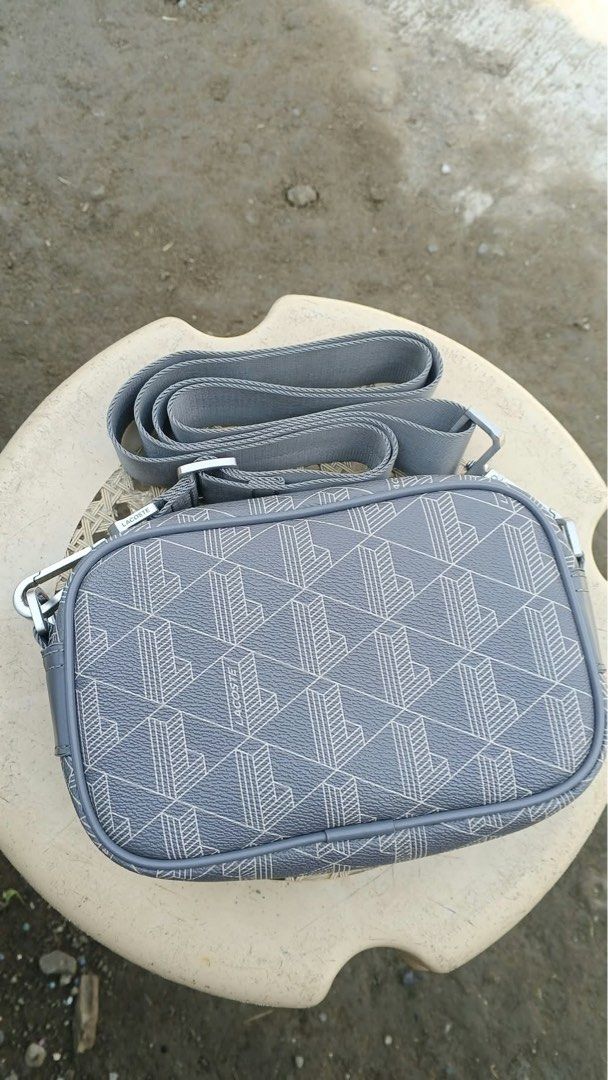 Lacoste mono gram sling bag (Category: Luxury Bags & Wallets) located in Bayambang. Submitted by frugal_vouge (Listing ID 1470366137, Image 3). Description: Issue see pic minimal only not visible when worn.