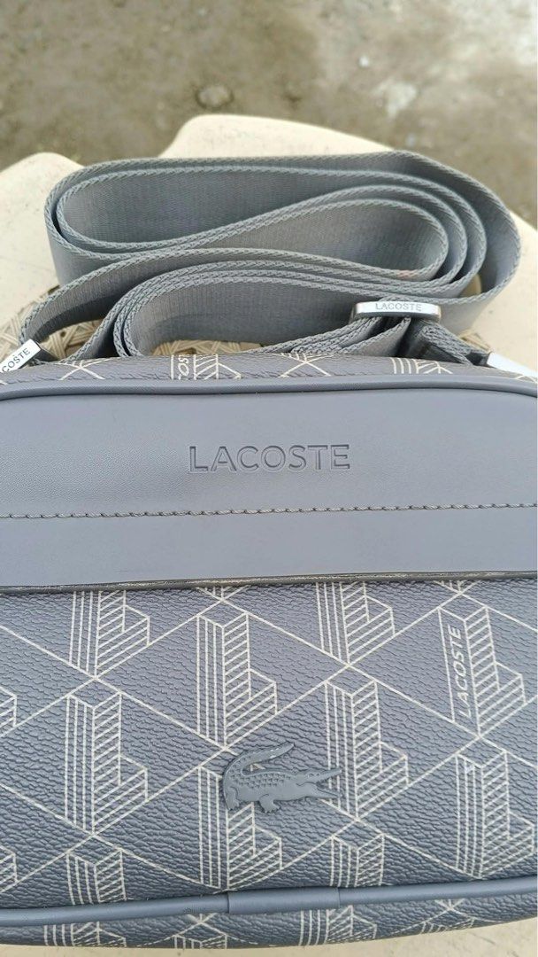 Lacoste mono gram sling bag (Category: Luxury Bags & Wallets) located in Bayambang. Submitted by frugal_vouge (Listing ID 1470366137, Image 2). Description: Issue see pic minimal only not visible when worn.