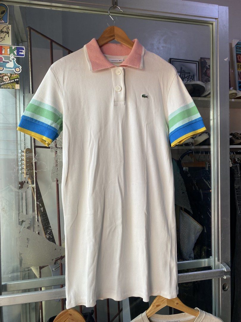 Lacoste Waffle Dress Polo (Category: Dresses) located in Kalibo. Submitted by rvna23 (Listing ID 1470376284, Image 1). Description: Lacoste white waffle-knit polo shirt featuring a pink ribbed collar and multi-colored striped cuffs dimes 34 x 19 no issue .