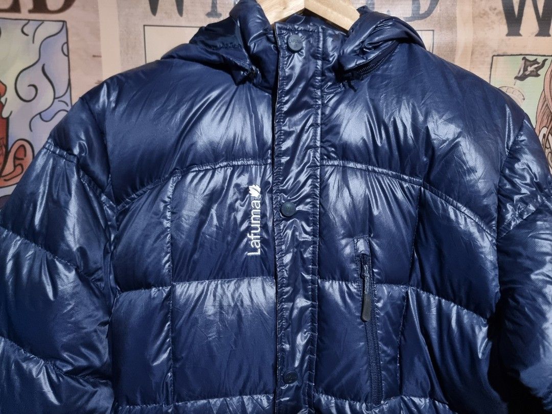 Lafuma Down Puffer Jacket With Hood (Category: Coats, Jackets and Outerwear) located in Imus. Submitted by aim_for_less (Listing ID 1470369759, Image 3). Description: Lafuma Down Puffer Jacket With Hood - Brand: Lafuma - SIZE: MEDIUM - DIMES: 23" x 32" - Color: Navy blue - Material: Warm down puffer with quilted pattern - Hood: Built-in hood for extra protection - Pockets: 1 zippered chest pocket and 2 lower snap-flap pockets - Details: Logo-stam