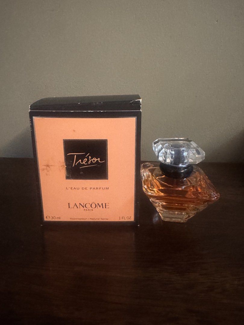 Lancôme Trésor L'Eau De Parfum 30ml With Box (Category: Fragrance & Deodorants) located in Quezon City. Submitted by damaxtraspace (Listing ID 1470453808, Image 1). Description: - Brand: Lancôme Trésor L'Eau de Parfum - Size: 30ml / 1 Fluid Ounce (Natural Spray) - Condition: Lightly used; almost full - Packaging: Original black and peach box included - Bottle: Classic diamond-shaped glass with signature black collar - Fragrance: Timeless, elegant