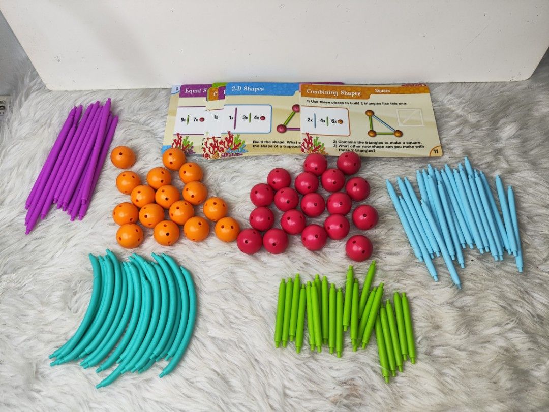 Learning Resources Dive into Shapes Geometry Set 129 Pieces (Category: Educational & Learning Toys) located in Cavite. Submitted by tinetaclesss (Listing ID 1470408495, Image 3). Description: Learning Resources Dive into Shapes geometry set with 129 pieces. Build 2D and 3D shapes. Includes rods, connector balls, curved pieces, and activity cards. Original box included. Great educational toy for kids learning math and shapes. Everything is laid ou