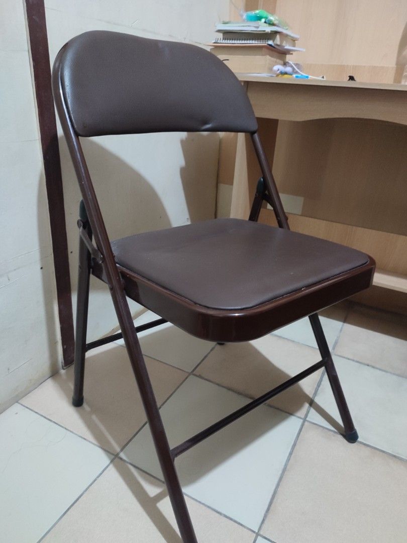 Leather Office Folding Chair (Category: Chairs) located in Paranaque City. Submitted by breealigam24841 (Listing ID 1470446411, Image 1). Description: Color: Coffee brown (leather seat, backrest, and matching frame) Condition: Lightly used and sturdy; No issues Use: Compact size, ideal for extra seating at home or in the office *Bought this around February this year (2026) for Php 410.00 Reason for Selling: Will be moving out of my apartment. Hin
