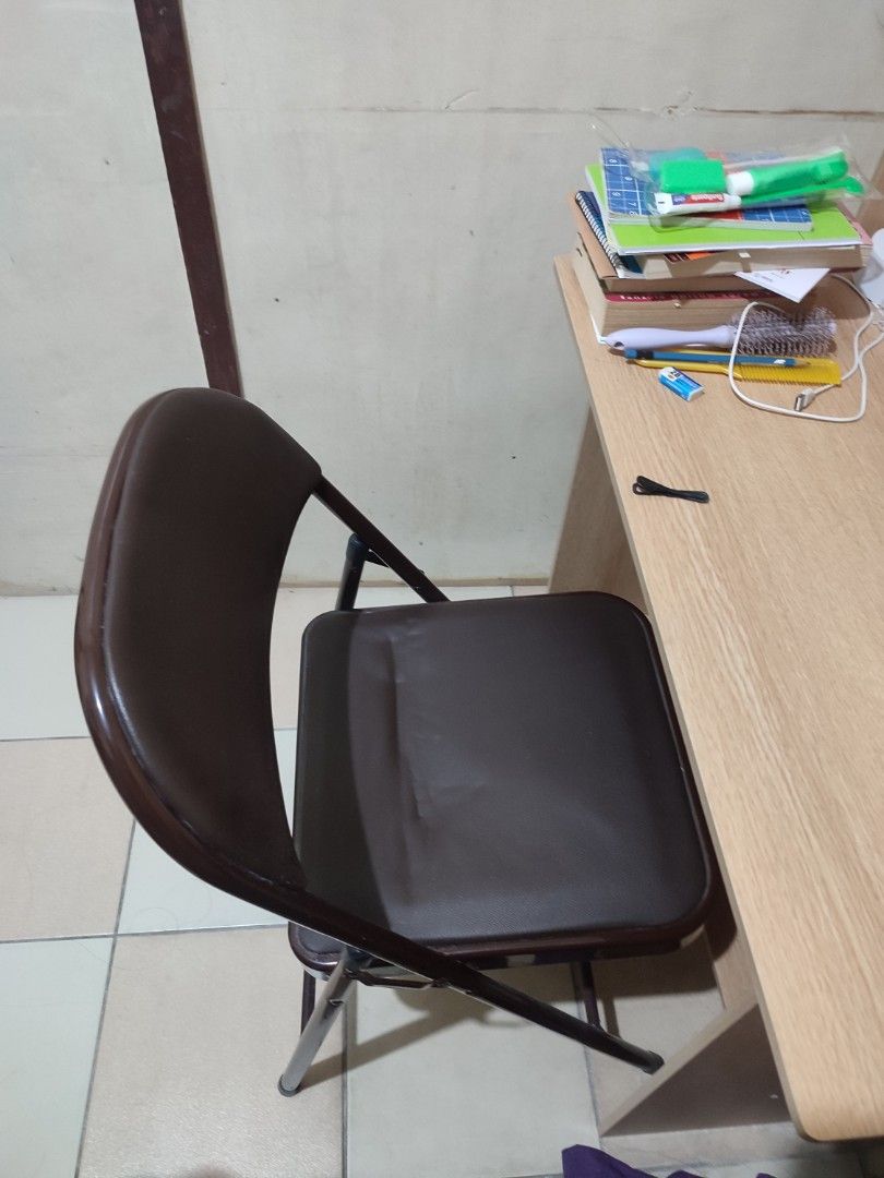 Leather Office Folding Chair (Category: Chairs) located in Paranaque City. Submitted by breealigam24841 (Listing ID 1470446411, Image 3). Description: Color: Coffee brown (leather seat, backrest, and matching frame) Condition: Lightly used and sturdy; No issues Use: Compact size, ideal for extra seating at home or in the office *Bought this around February this year (2026) for Php 410.00 Reason for Selling: Will be moving out of my apartment. Hin