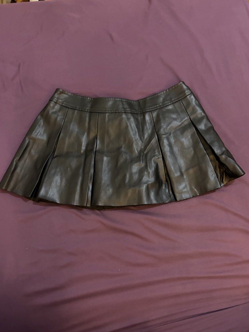 Leather Pleated Skirt (Category: Skirts) located in Las Pinas. Submitted by hanrue12 (Listing ID 1470408904, Image 2). Description: - Material: PU Leather - Style: Pleated mini skirt - Condition: Used twice, good condition - Vibe: Edgy, stylish, and versatile for outfits.