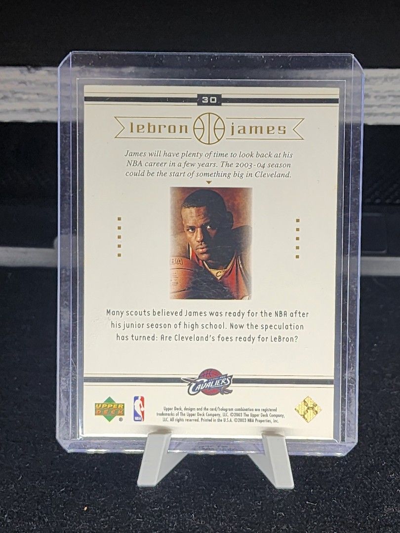 LeBron James 30 (Category: Raw Singles) located in Manila. Submitted by kg613 (Listing ID 1470380443, Image 2). Description: - Player: LeBron James - Brand/Set: Upper Deck #30 - Team: Cleveland Cavaliers - Design: Gold background with player write-up and early photo on the back - Condition: Clean edges and sharp corners, stored in a top loader since day one - Perfect for basketball card collectors and fans.