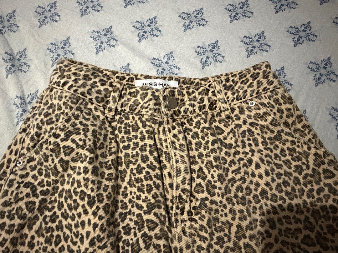 leopard print denim skirt (Category: Skirts) located in Angeles City. Submitted by charishurb08031 (Listing ID 1470550665, Image 3). Description: - Size 24-25 - Pattern: Classic leopard print - Fit: High waist with belt loops - Length: 13 - Features: Front and back pockets, button closure - Material: hard denim with clear animal print detailing - Condition: Excellent addition to any casual wardrobe mop: gcash, maribank, bpi mod: jnt loc: pampanga