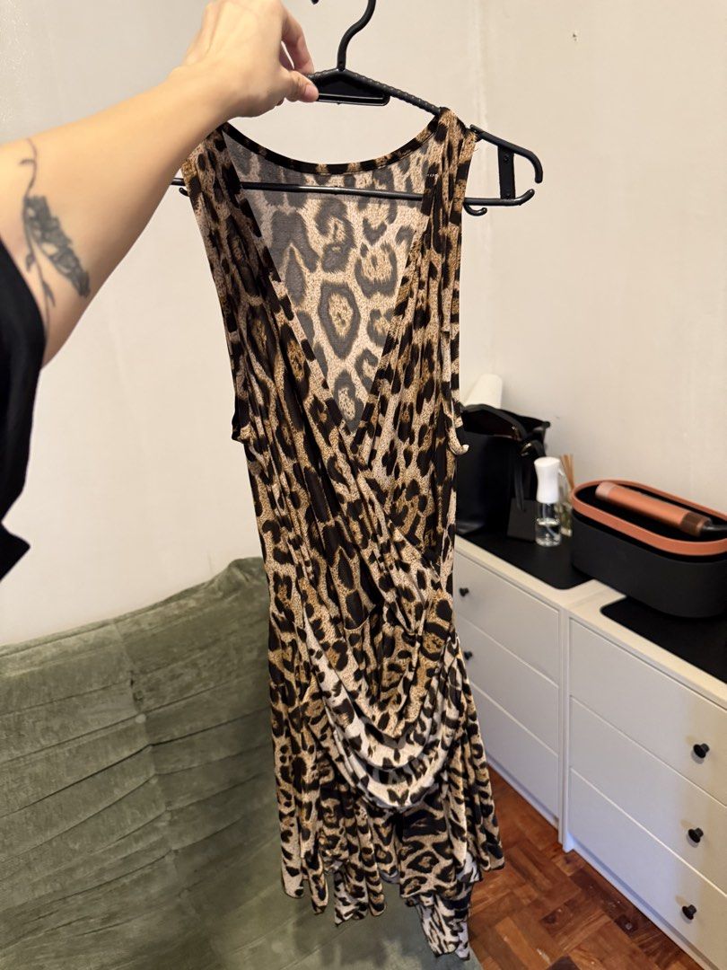 Leopard print sleeveless dress (Category: Dresses) located in Taguig. Submitted by andarieph (Listing ID 1470428478, Image 2). Description: - Leopard print sleeveless dress - Trendy asymmetrical hemline with front draping detail - Lightweight and comfortable fabric - Can include a matching fluffy leopard print headband with ears if needed for a costume - Perfect for parties, clubs, and night outs.