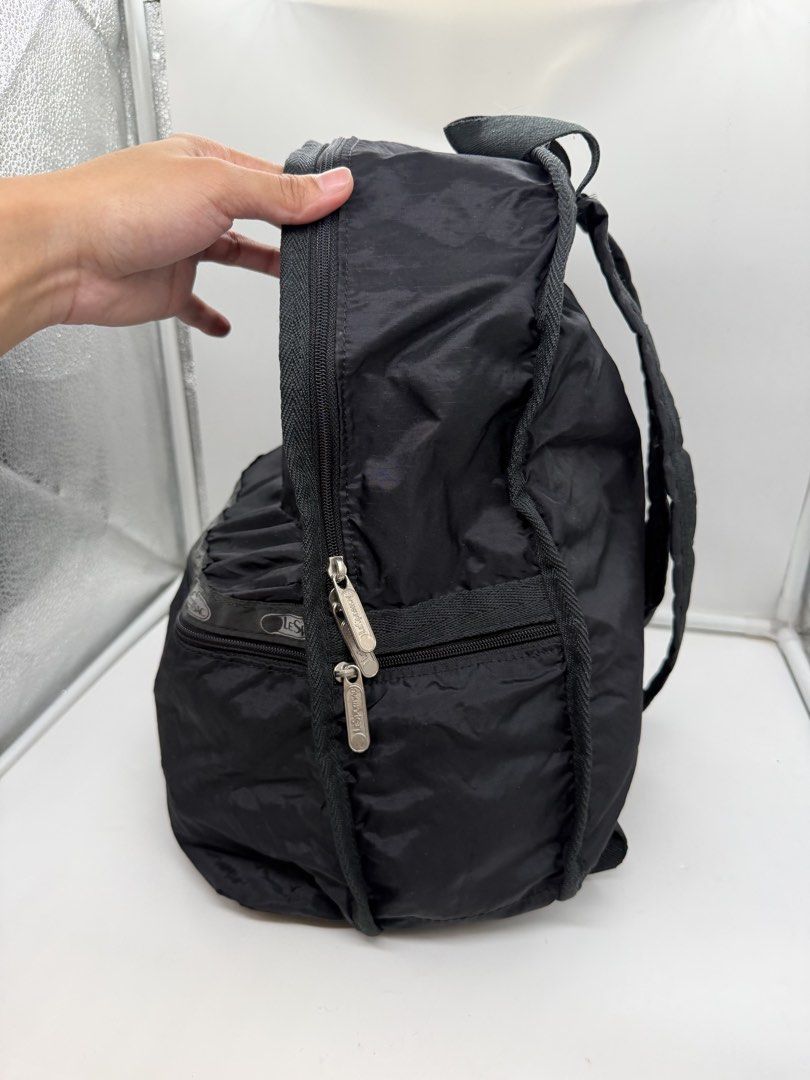 LeSportsac Black Unisex Classic Basic lightweight nylon Backpack (Category: Backpacks) located in Cavite. Submitted by aellavier (Listing ID 1470360122, Image 2). Description: orig preloved auth. minila sigjs of use needs laba if maselan. preloved no tears .