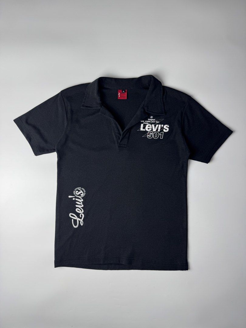 Levi's 501 Black Polo Shirt (Category: Tshirts & Polo Shirts ) located in Cavite. Submitted by dracokidstuff (Listing ID 1470375352, Image 1). Description: - Brand: Levi's Red Tab 501 - Color: Black - Size: Men's Medium - Design: Graphic print on chest, script logo near hem, large branding on back shoulders - Style: Short sleeves, classic collar, V-neck placket - Pit-to-Pit: ~20.5 inches - Length: ~24.5 inches.
