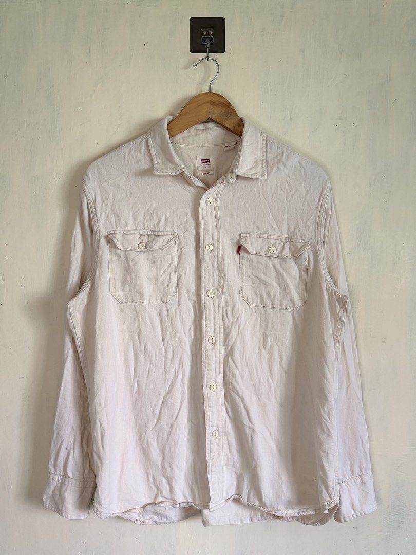 Levi's Standard Fit Off-White Button-Down Shirt Size L (Category: Formal Shirts) located in Manila. Submitted by snipe.shit (Listing ID 1470424710, Image 1). Description: - Brand: Levi's - Style: Long sleeve button-down shirt - Color: Off-white - Size: Large - Material: Solid cotton-blend twill - Details: Dual chest pockets, signature red tab logo, standard collar, button cuffs - Condition: Excellent, well-maintained - Shipping: Ships out via J&T