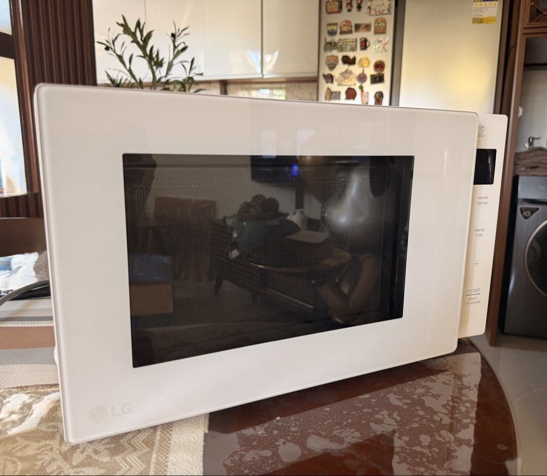 LG Inverter Microwave Oven White (Category: Ovens & Toasters) located in Muntinlupa City. Submitted by rnrsnpstr (Listing ID 1470397581, Image 1). Description: - Brand/Model: LG Countertop Microwave - Color/Design: Clean white finish with a sleek glass front and minimalist aesthetic - Controls: Easy-to-use right-side touch panel with a clear digital display - Features: Advanced Inverter technology for precise defrosting and cooking - Condition: D