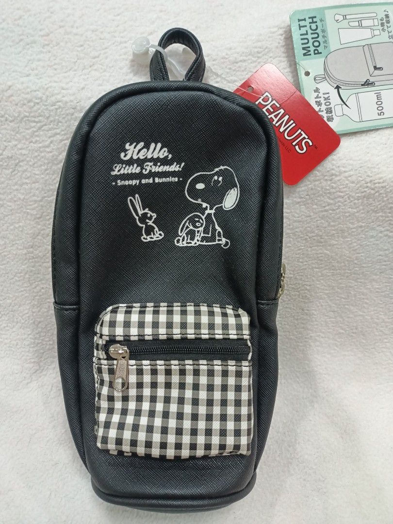Licensed Peanuts Snoopy and Bunnies Multi Pouch Black (Category: Purses & Pouches) located in Manila. Submitted by jollynest24 (Listing ID 1470501577, Image 1). Description: - Authentic and Brand new with tag still attached - Design: Snoopy and bunnies print on black faux leather with grey & white gingham front zip pocket - Capacity: Fits a 500ml bottle upright plus space for cosmetics or stationery - Features a convenient top loop handle - Multi