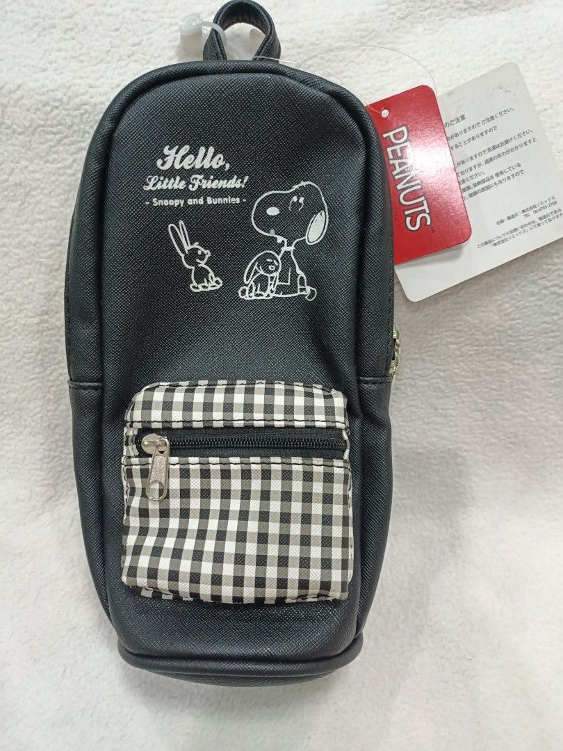 Licensed Peanuts Snoopy and Bunnies Multi Pouch Black (Category: Purses & Pouches) located in Manila. Submitted by jollynest24 (Listing ID 1470501577, Image 2). Description: - Authentic and Brand new with tag still attached - Design: Snoopy and bunnies print on black faux leather with grey & white gingham front zip pocket - Capacity: Fits a 500ml bottle upright plus space for cosmetics or stationery - Features a convenient top loop handle - Multi