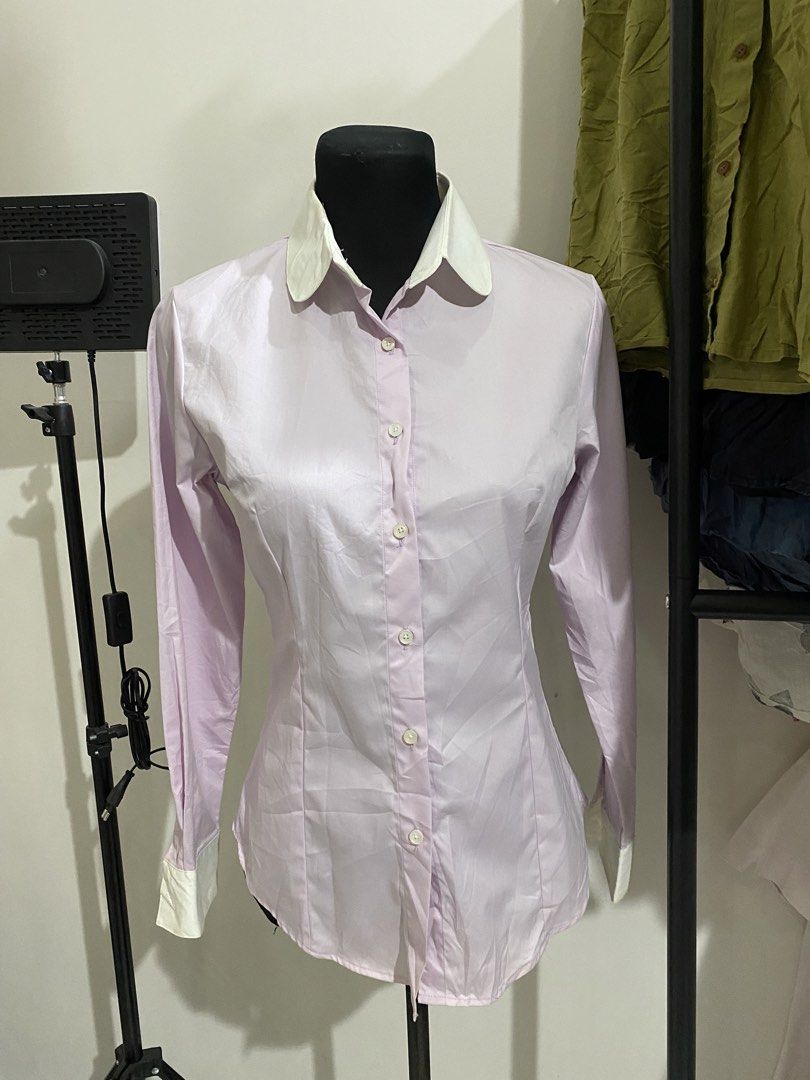 Light Purple Long Sleeve Button Down Shirt with White Collar (Category: Longsleeves) located in Manila. Submitted by mpt99876 (Listing ID 1470496213, Image 1). Description: - Color: Light purple with contrasting white pointed collar and cuffs - Fit: Tailored with bust darts and waist seams for a flattering silhouette - Details: Front button closure, lightweight fabric with a slight sheen - Condition: Excellent - Perfect for: Office wear, intervie
