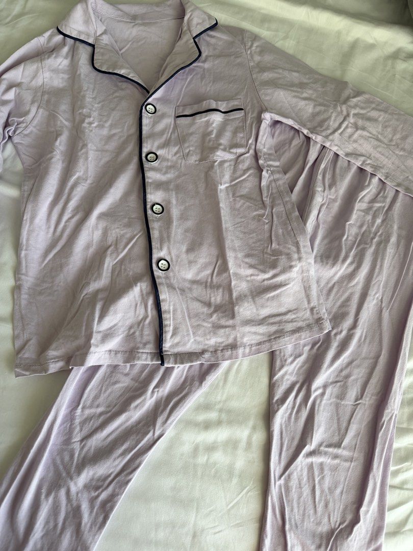 Light purple pajama set with dark piping (Category: Babies & Kids Fashion) located in Pasig City. Submitted by kekzie30 (Listing ID 1470556775, Image 2). Description: - Color: Light purple with navy blue piping trim - Material: Soft and breathable cotton - Top: Long sleeve, button-down, chest pocket, notched collar - Bottoms: Pants with a stretchy elastic waistband - Perfect for: Sleeping or lounging around the house - size: fits 5-7 years old.