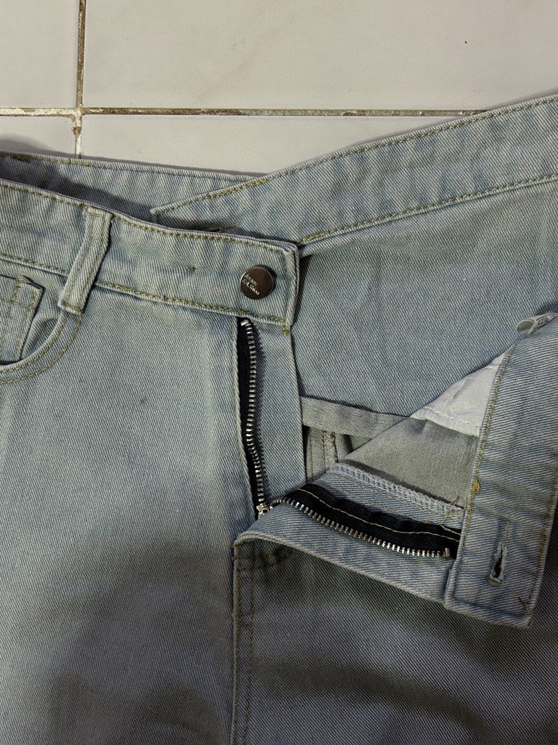 Light Wash Asymmetrical Jeans (Category: Jeans) located in Manila. Submitted by viyyu (Listing ID 1470416183, Image 2). Description: •Loose straight-leg denim jeans •asymmetric crossover design •Light wash with no heavy fading •Button fly, zip closure, and back pockets.