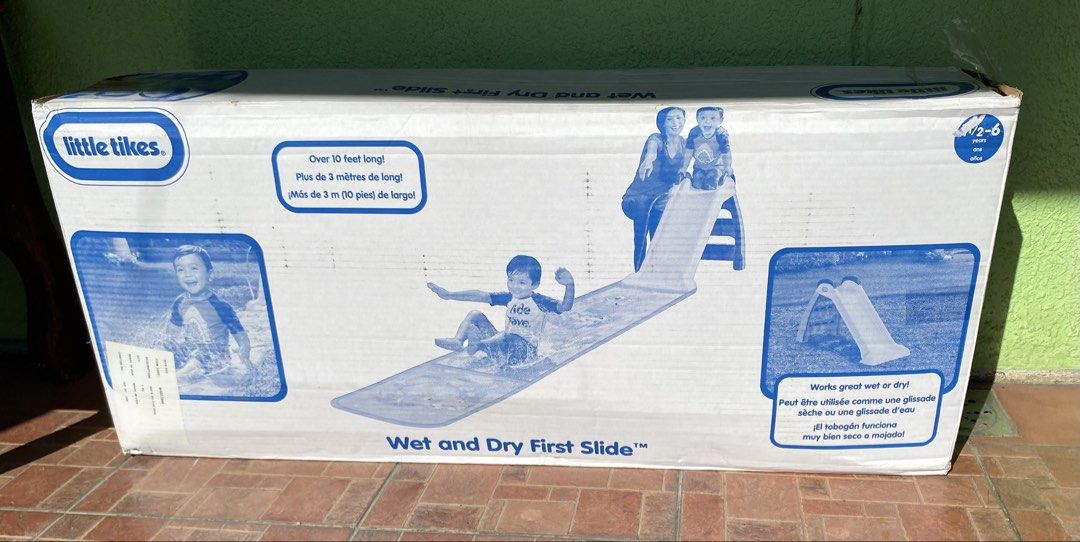 Little Tikes Wet and Dry First Slide (Category: Infant Playtime) located in Muntinlupa City. Submitted by bloo_berry (Listing ID 1470357136, Image 2). Description: - Brand: Little Tikes Wet and Dry First Slide - Age Range: Suitable for toddlers aged 2 to 6 years old - Size: Over 10 feet long total - Features: Includes water attachment for versatile wet or dry play in the backyard - Condition: Brand new, unopened package in the original box.