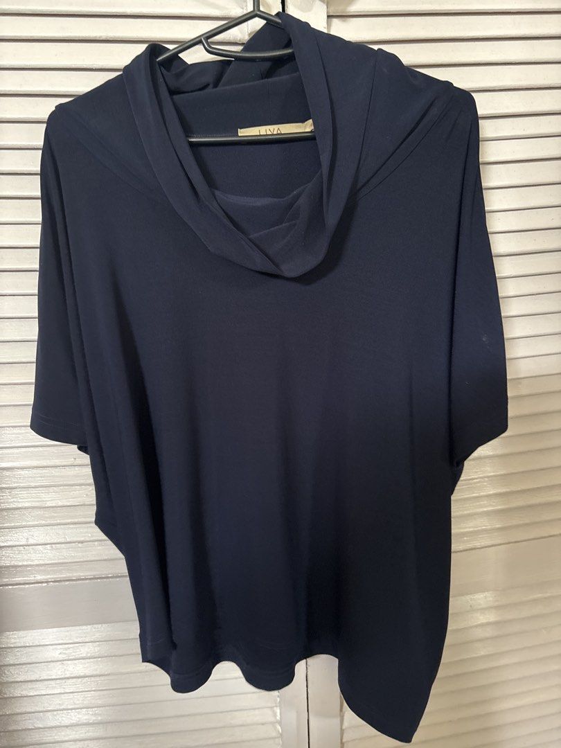 Liva Navy Blue Cowl Neck Blouse (Category: Blouses) located in Makati City. Submitted by goodfindsonly (Listing ID 1470415810, Image 1). Description: - Brand: Liva - Color: Navy blue - Neckline: Cowl neck - Sleeves: Short sleeves - Fit: Relaxed, drapey, and soft - Styling: Pairs well with white pants or casual trousers - Condition: Excellent everyday wear.